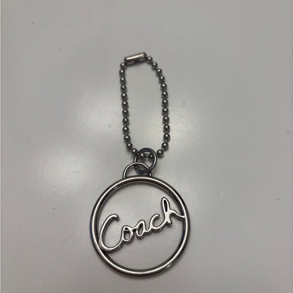 Coach round silver script spellout metal hang tag purse charm chain